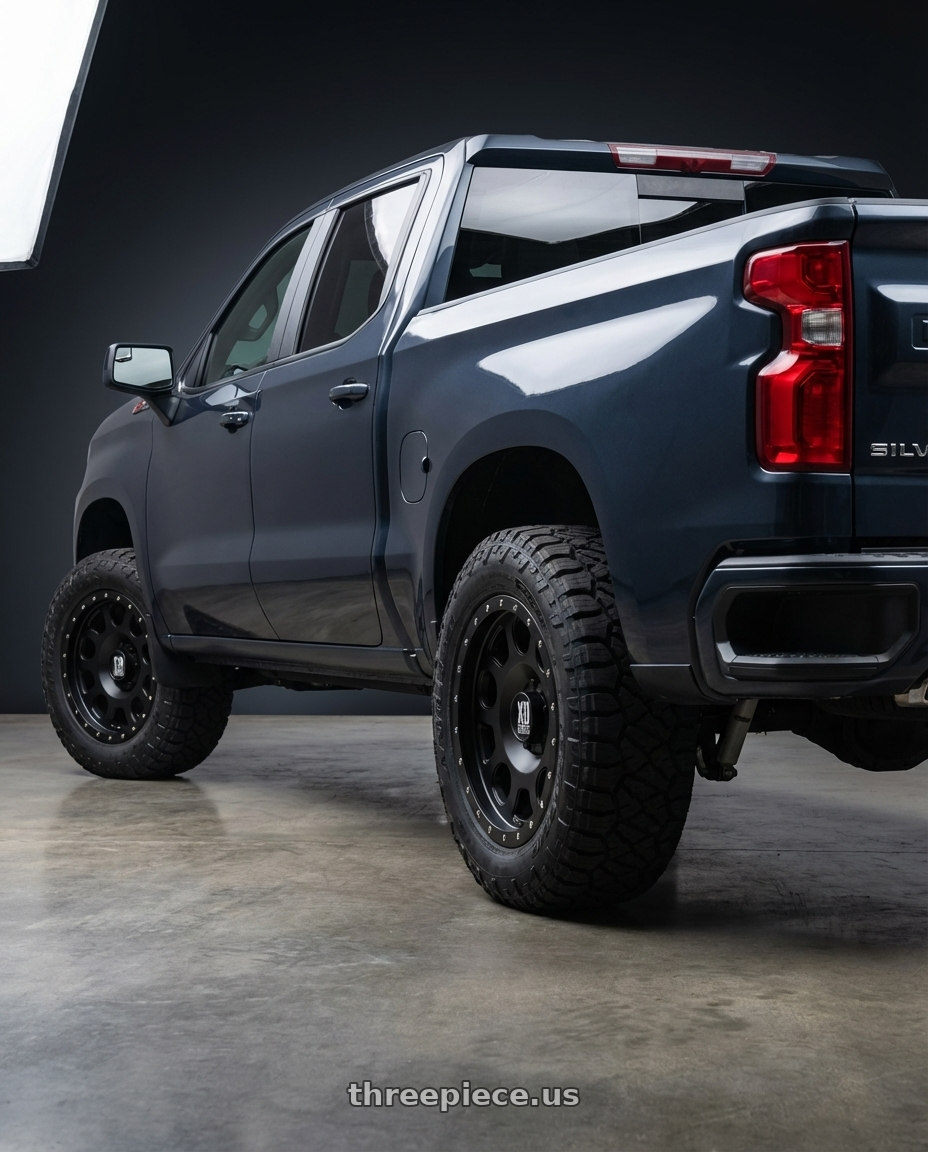 2023 Chevrolet Silverado 1500 with XD XD126 ENDURO PRO 6X139.7 20X10 -24 SATIN BLACK WITH REINFORCING RING wheels rear three quarter view meaty tires