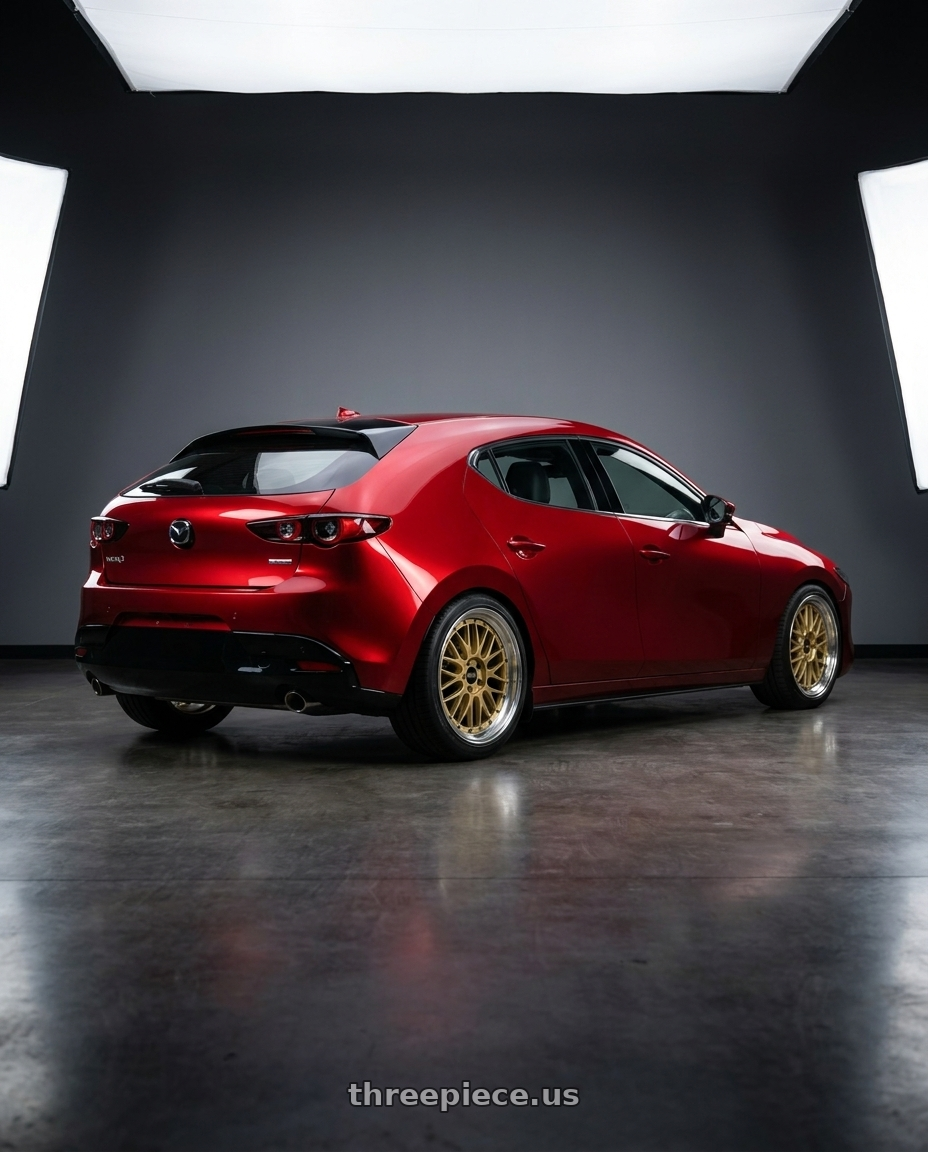 2024 Mazda 3 with BBS LM 5x112 19x9.0+42 Gold wheels rear three quarter view slight stretch tires