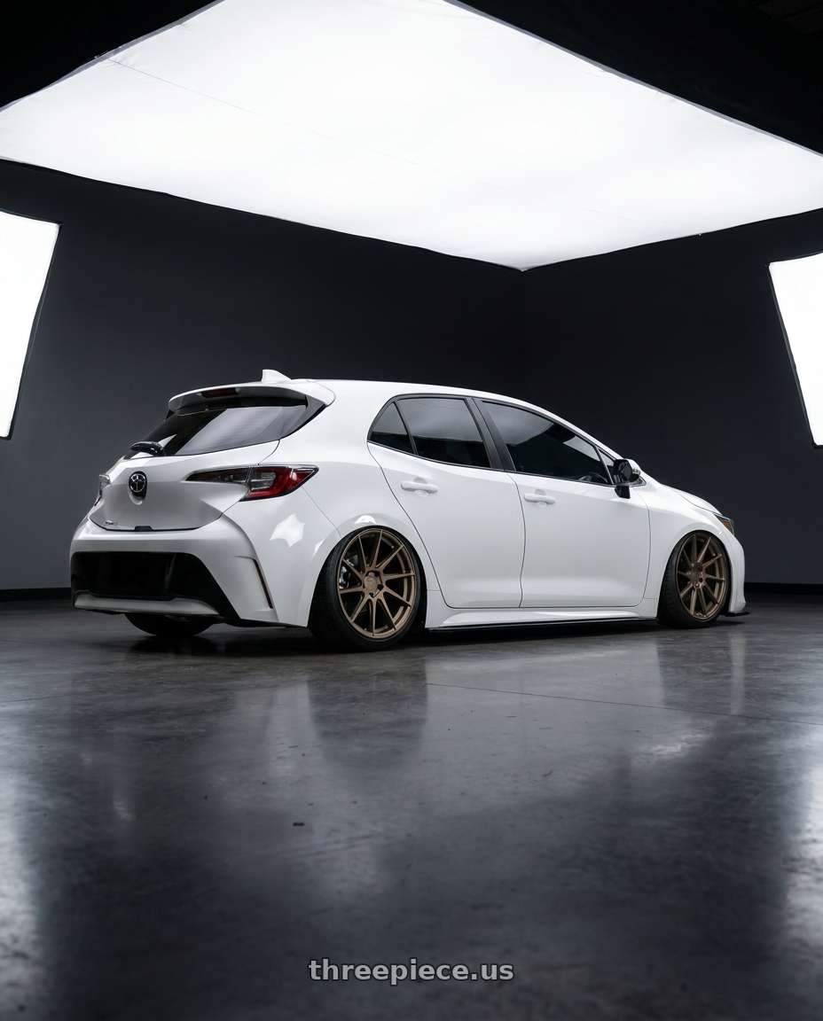 2023 Toyota Corolla Hatchback with Aodhan AH09 5x114.3 18x8.5 +35 Matte Bronze wheels rear three quarter view slight stretch tires