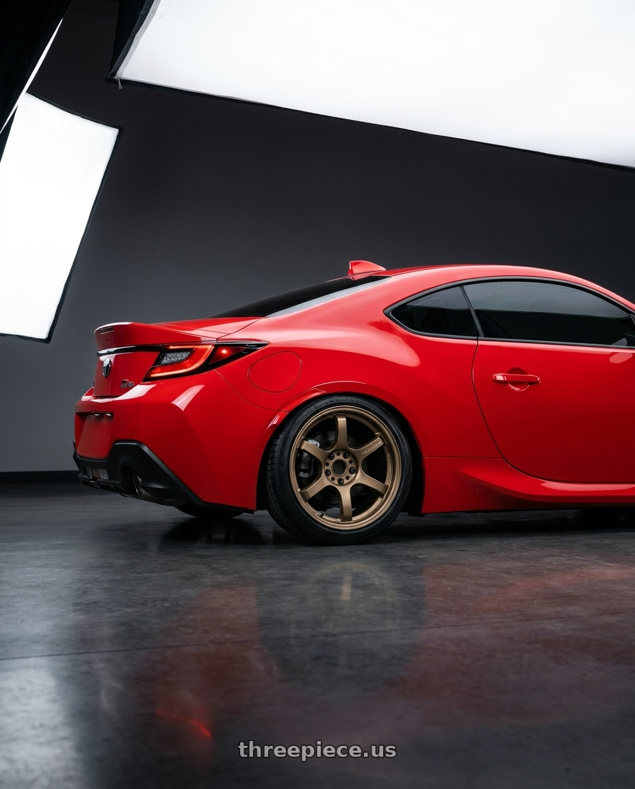2024 Toyota GR86 Track Red with Gram Lights 57DR 5x100 18x9.5 +38 BRONZE 2 wheels rear three quarter view square tires