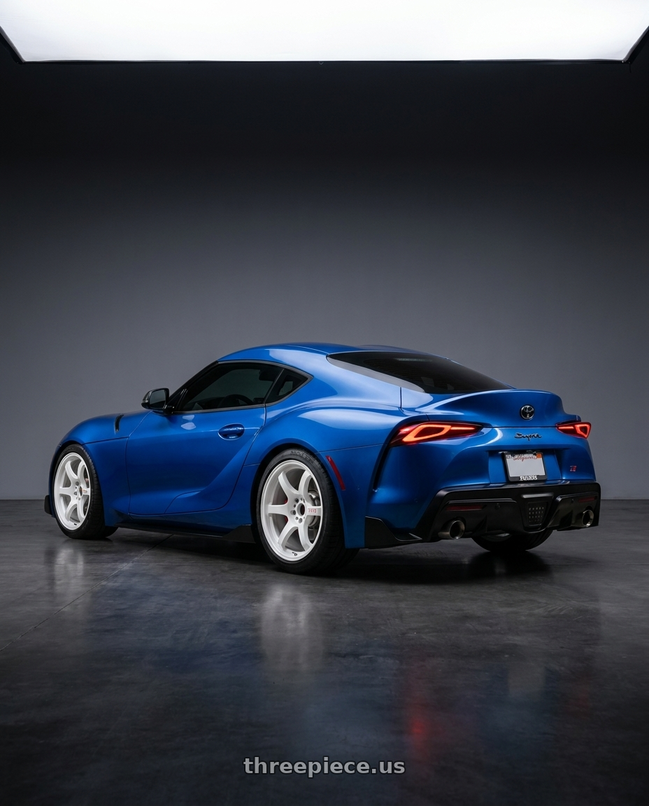 2023 Toyota supra with Gram Lights 57DR 5x100 18x9.5 +38 CERAMIC PEARL wheels rear three quarter view square tires