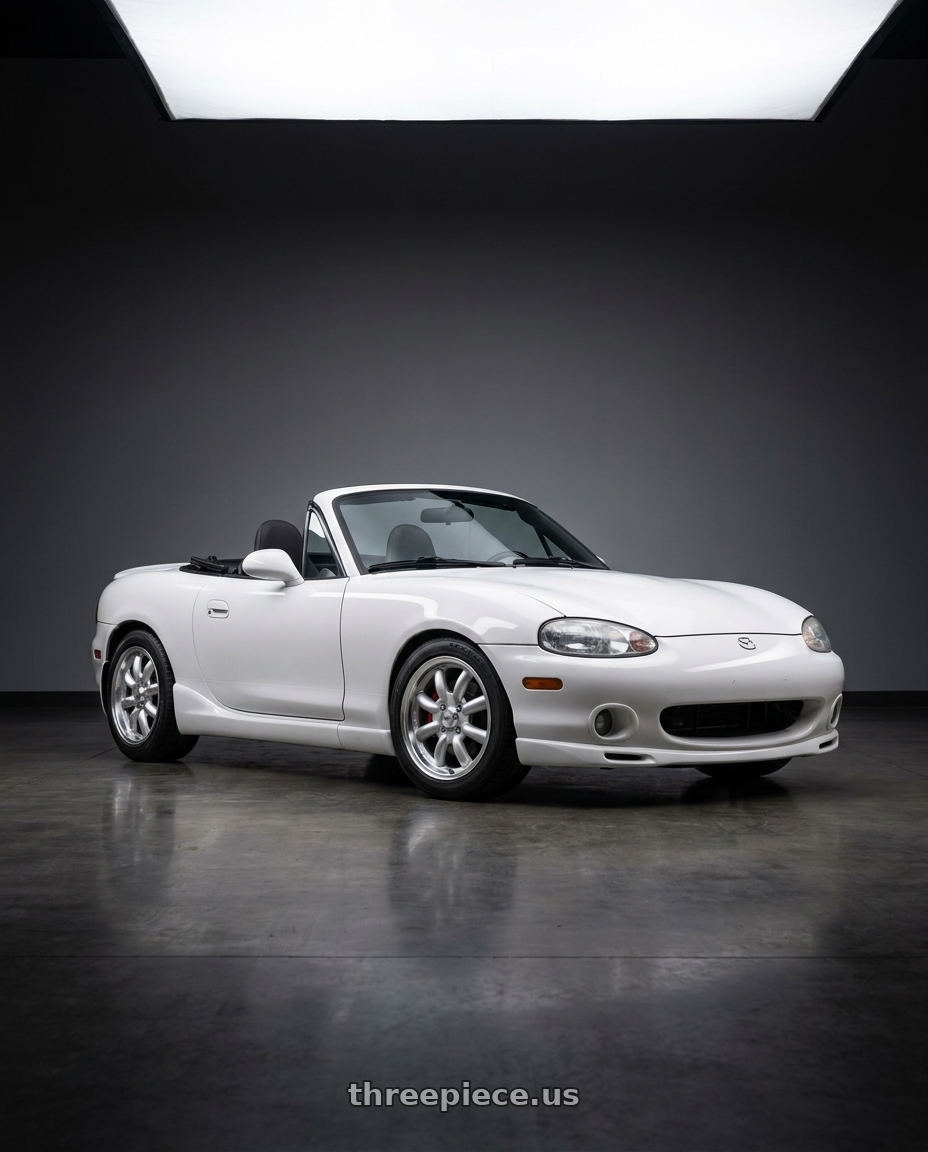 2003 Mazda Miata  with Konig Rewind 4x100 15x7+20 Silver wheels
