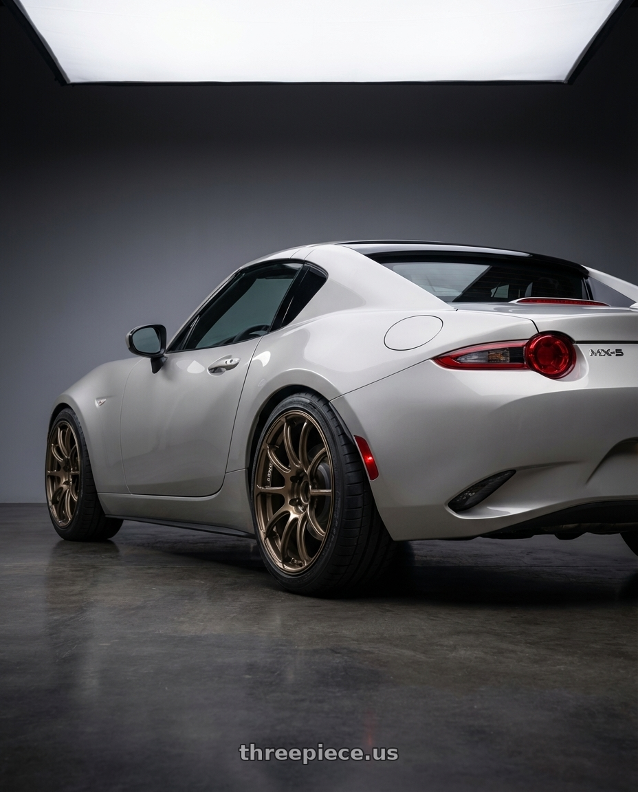 2021 Mazda MX-5 Miata ND with Advan RZ II 5x114.3 17x9.0+63 Racing Bronze wheels rear three quarter view square tires