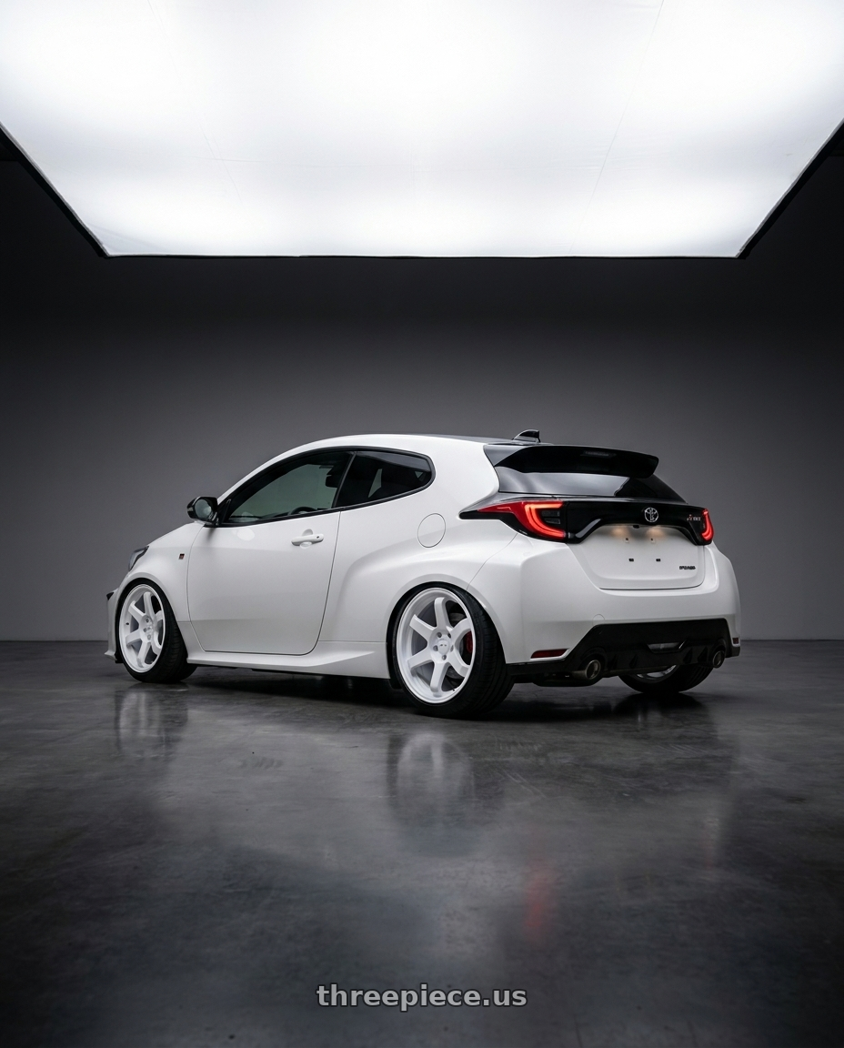 2021 Gr yaris with F1R F106 5x114.3 17x8 +35 White wheels rear three quarter view slight stretch tires