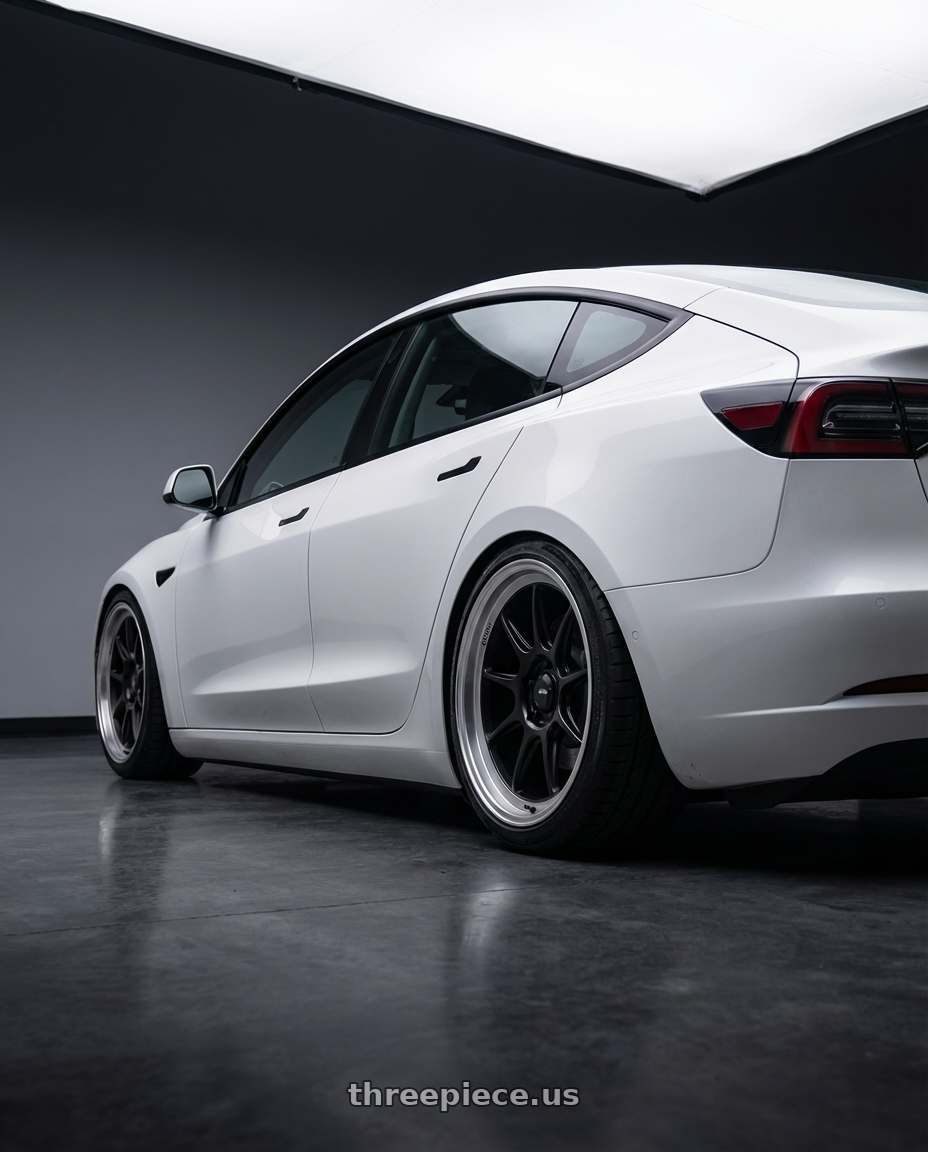 2023 Tesla Model 3 with Konig Countergram 5x114.3 19x9.5+25 Matte Black / Matte Machined Lip wheels rear three quarter view slight stretch tires