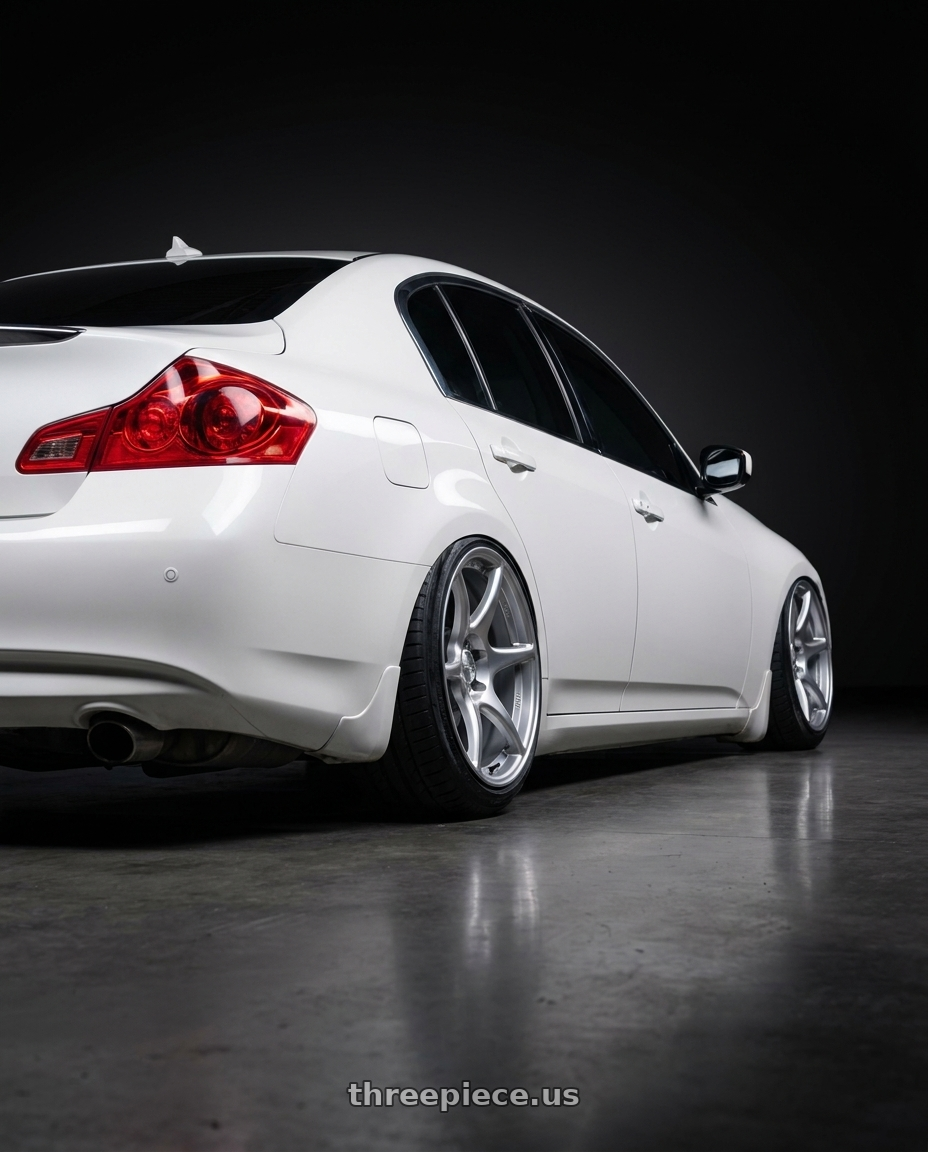 2010 Infiniti G37 with Kansei K11S Tandem 5x114.3 19x10.5 22 Hyper Silver wheels rear three quarter view extreme stretch tires