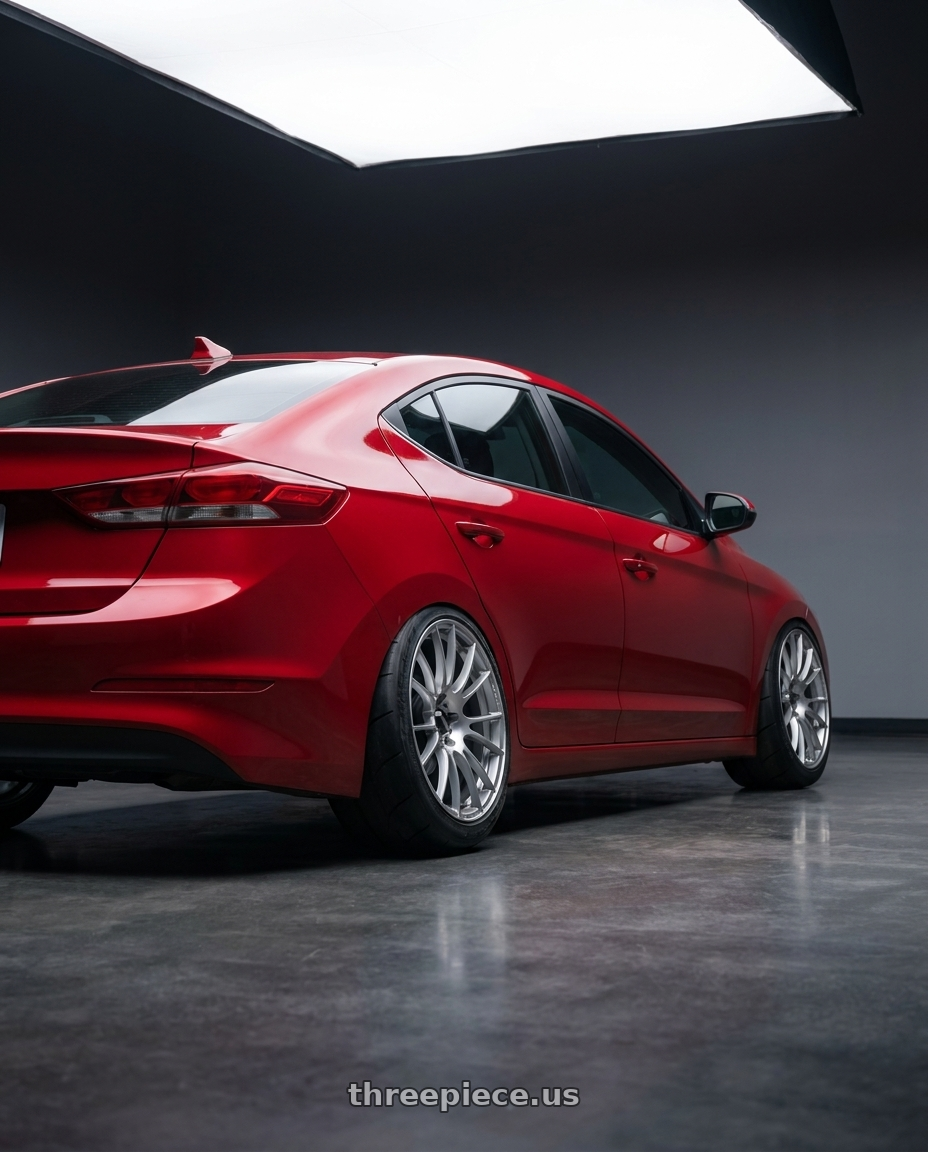 2017 Hyundai Elantra with WedsSport SA-72R Wide Spec 5x114.3 17x9.5+47 Circuit Silver II wheels rear three quarter view excessive tires