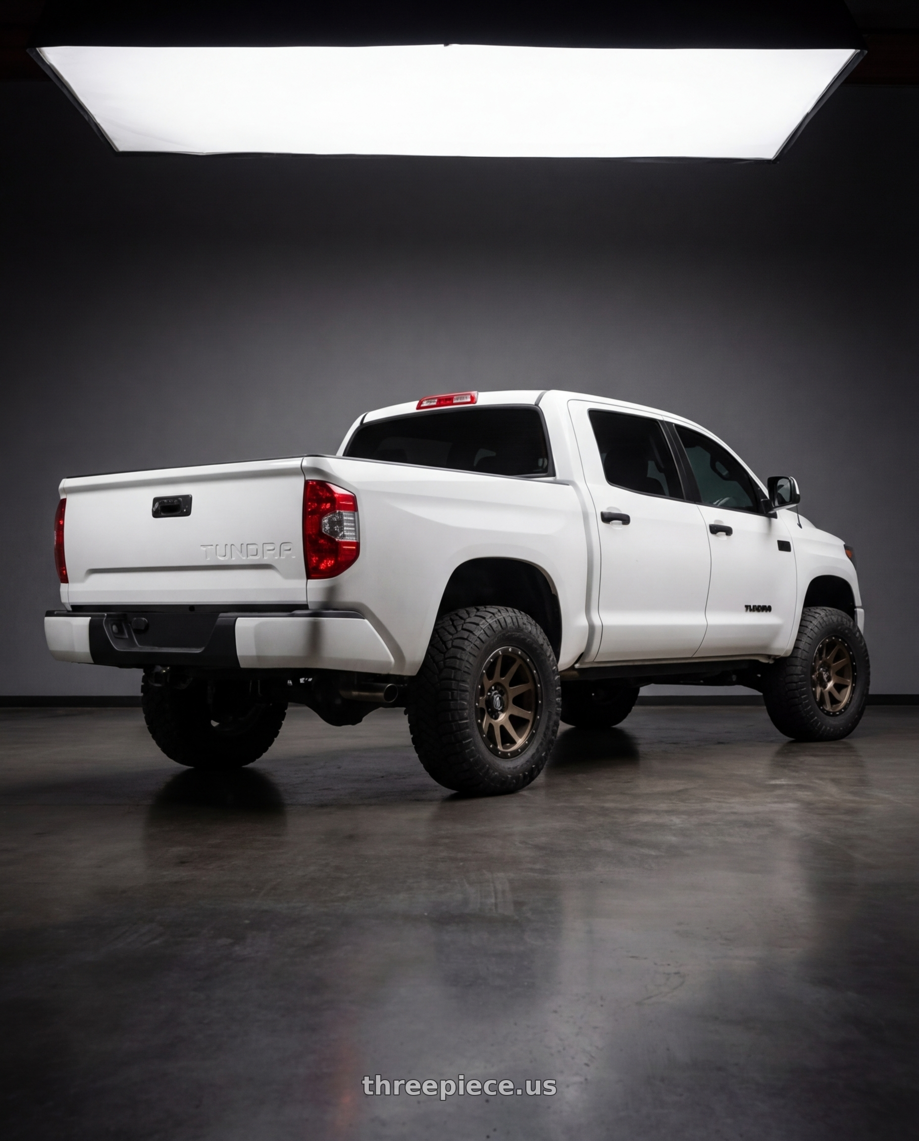 2021 Toyota tundra with Icon Alloys COMPRESSION 5x150 17x8.5+25 BRONZE wheels rear three quarter view meaty tires