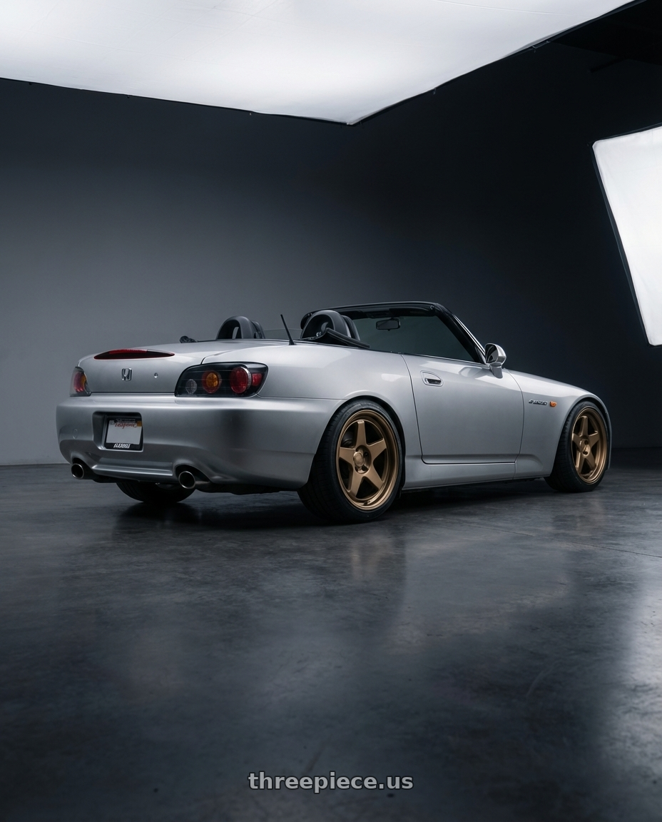 2009 Honda S2000 with Kansei K12B KNP 5x114.3 17x9.5 12 Bronze wheels rear three quarter view square tires