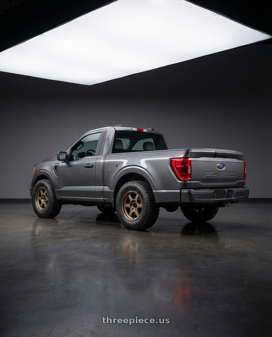 2026 ford 150  with Volk Racing TE37XT M-Spec 6x139.7 18x8.0+20 Bronze Almite wheels rear three quarter view meaty tires