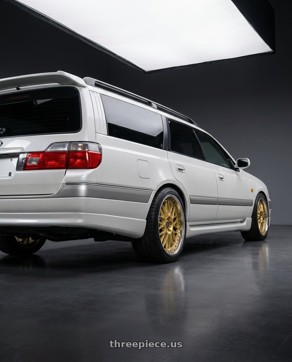 1997 nissan stagea with Work Vs-Xx 5x114.3 18x9+38 A Disk Gold wheels rear three quarter view square tires