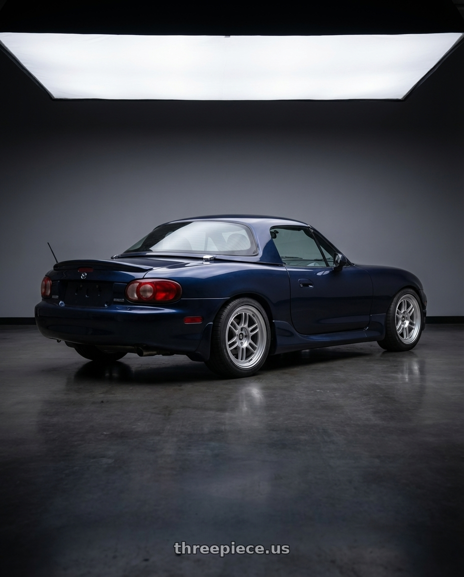 2002 mazda miata with Enkei RPF1 4x100 16x8+38 Silver wheels rear three quarter view square tires