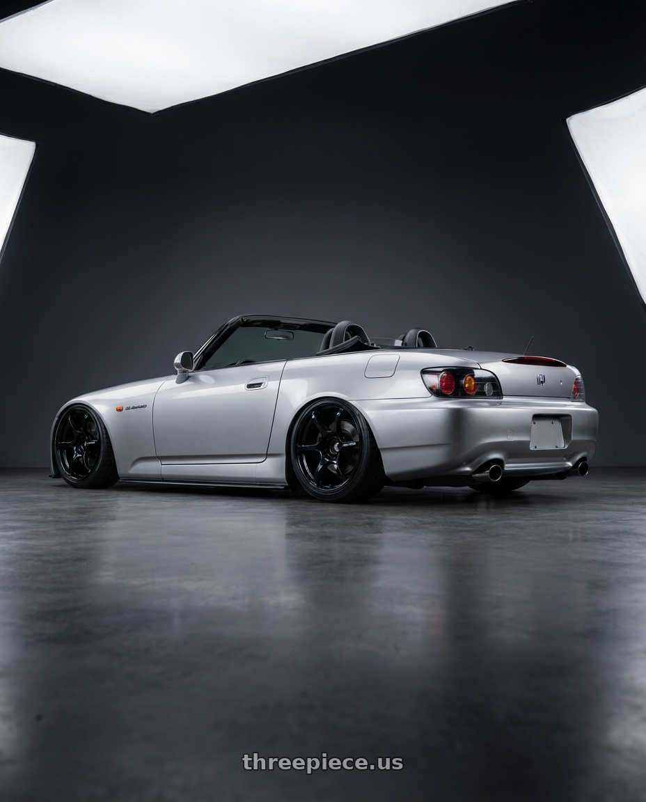 2009 Honda S2000 with Advan RGIII 5x114.3 18x9.0+45 Gloss Black wheels rear three quarter view slight stretch tires