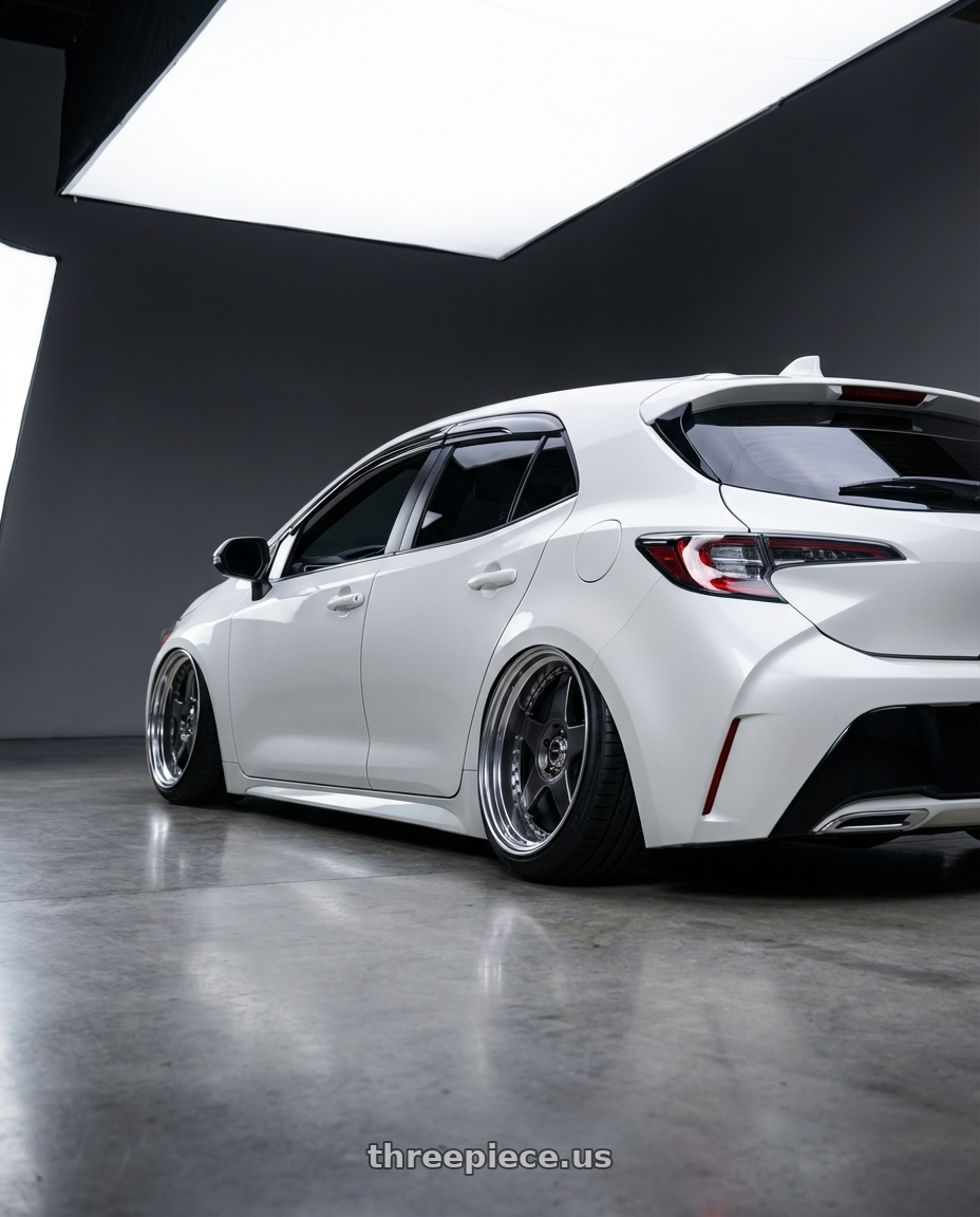 2019 Toyota Corolla hatchback with SSR Professor SP6 5x100 18X9.5+12 HP Disk Prism Dark Gunmetal wheels rear three quarter view extreme stretch tires