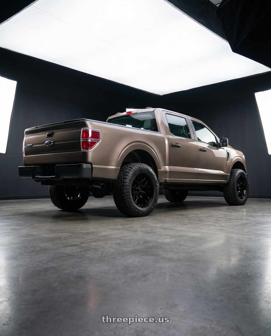 2013 Ford F-150 with Gear Off Road 768B 6X135/6x139.7 20x9 +0 Gloss Black wheels rear three quarter view meaty tires