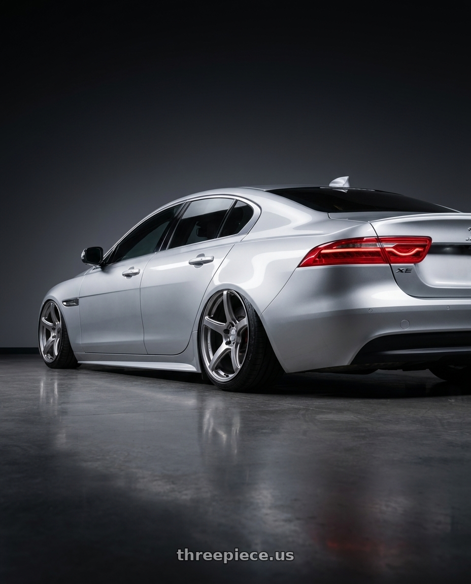 2017 Jaguar Xe with Work Emotion T5r 5x114.3 19x10.5 +15 Glow Silver wheels rear three quarter view square tires