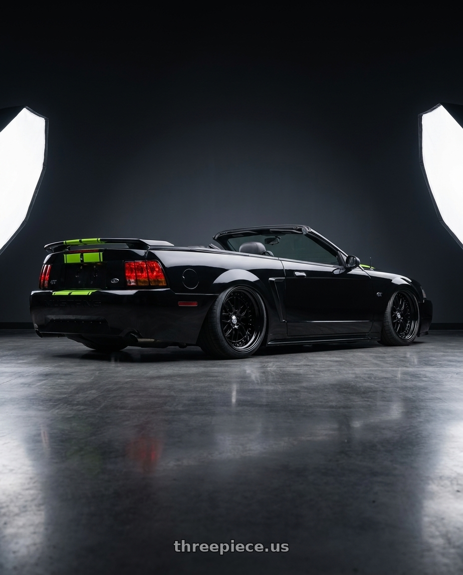 2000 mustang gt with Work Gran Seeker Dmx 5x100 20x7.5+19 O Disk Black wheels rear three quarter view extreme stretch tires