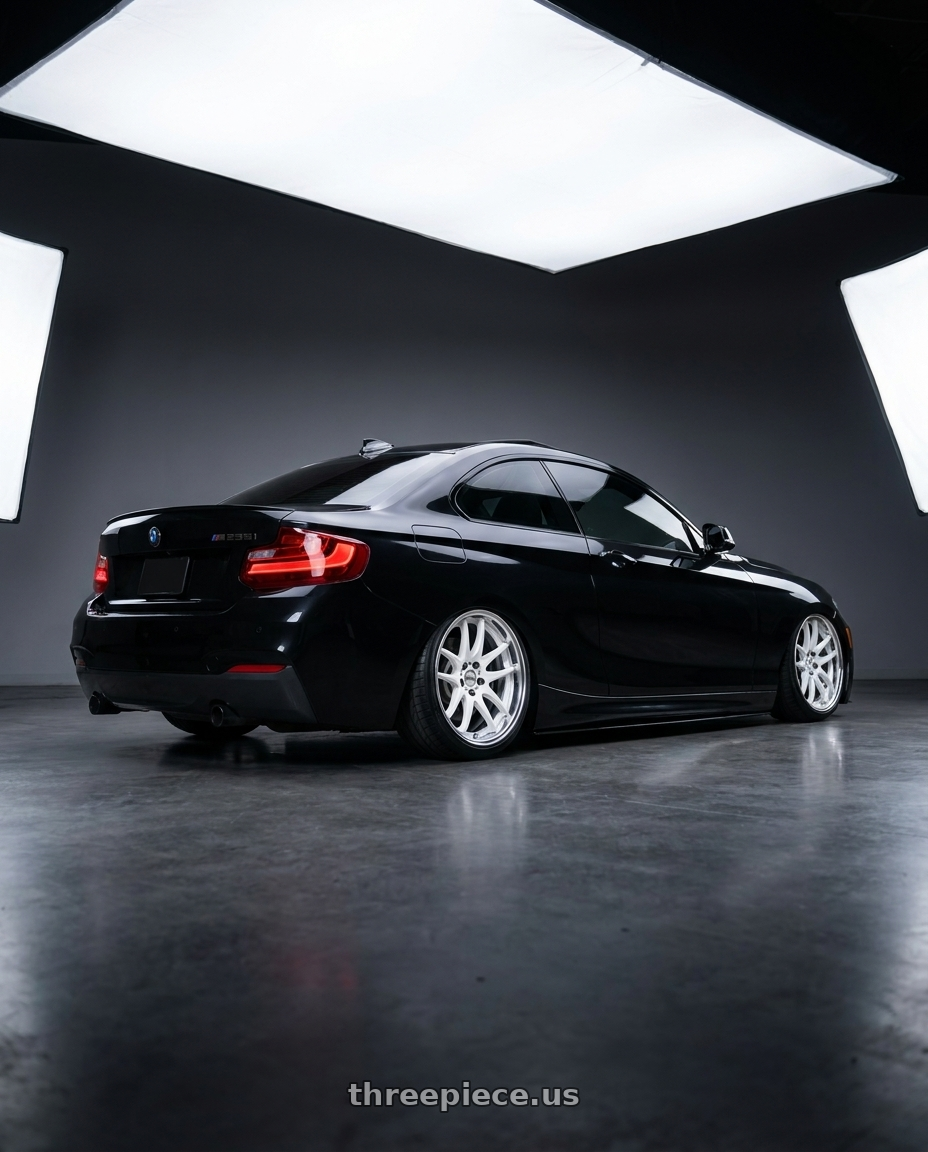 2015 bmw m235i with Work Cr 2P 5x120 18x8.5 +38 Gloss White wheels rear three quarter view slight stretch tires