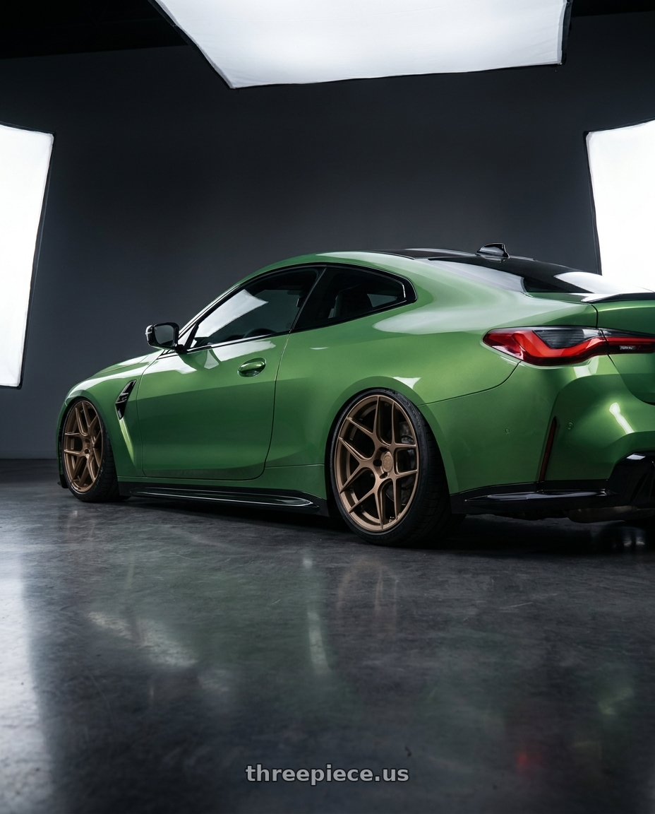 2024 BMW M4 G82 with Aodhan AFF2 5x112 19x8.5+35 Matte Bronze wheels rear three quarter view slight stretch tires