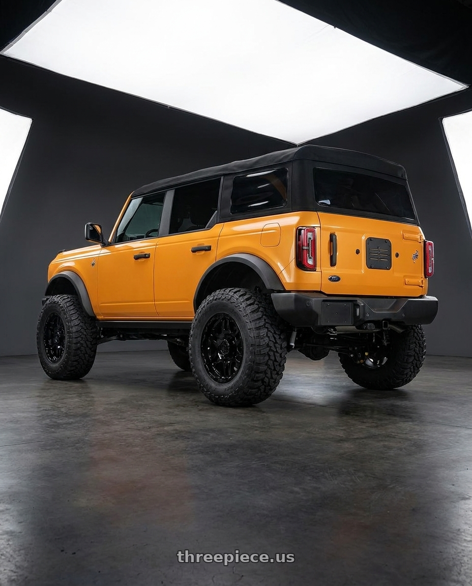 2024 Ford Bronco with Gear Off Road 713B 6x139.7 20x9 +10 Gloss Black wheels rear three quarter view meaty tires