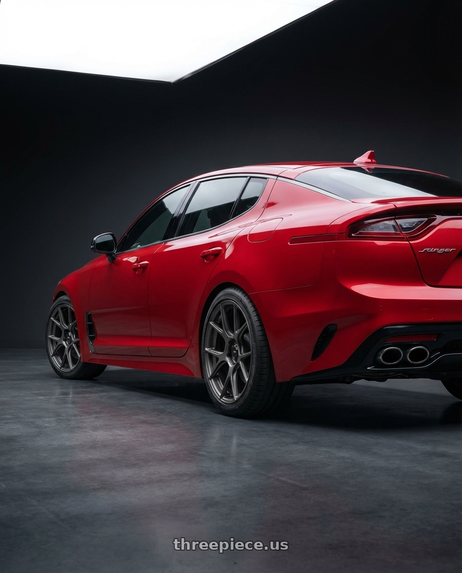 2022 Kia Stinger GT with Konig Ampliform 5x114.3 19x9.5+25 Dark Metallic Graphite wheels rear three quarter view square tires