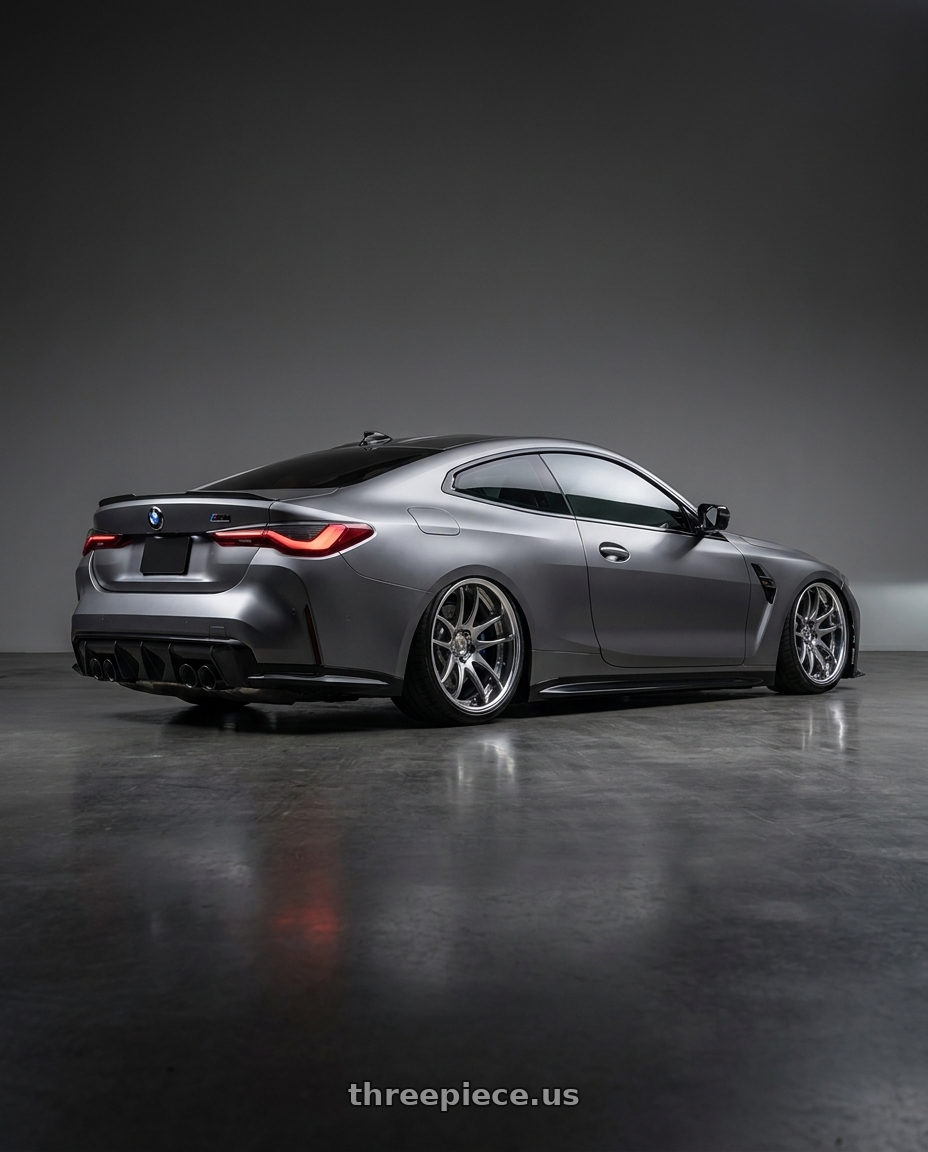 2027 bmw m4 competition with Work Cr 2P 5x112 20x11.0 +22 GT Silver wheels rear three quarter view slight stretch tires