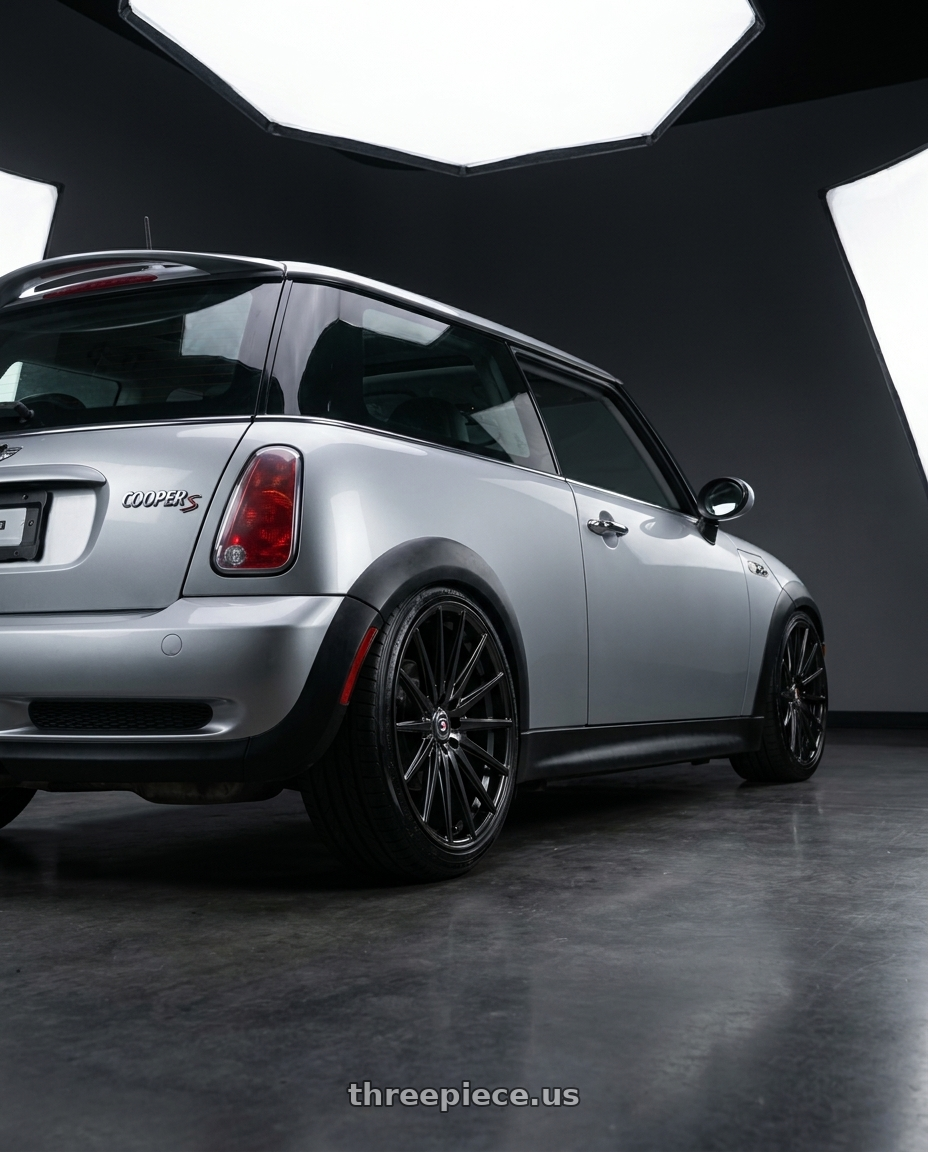2004 Mini cooper s with Spec-1 SP-69 4x100/4x114.3 17x7.5 +42 Gloss Black wheels rear three quarter view slight stretch tires