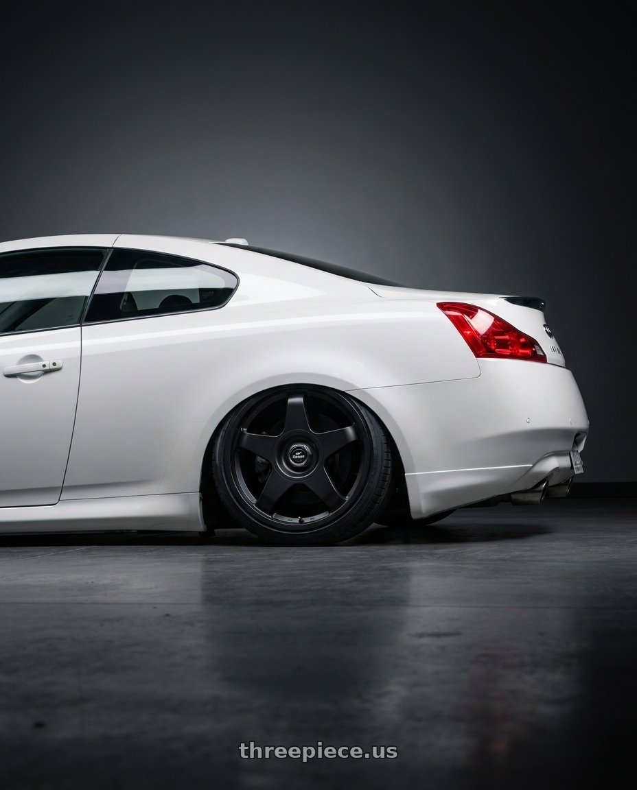 2014 Infiniti G37 Coupe with fifteen52 CHICANE 5x114.3 / 5x120 19x8.5 +35 ASPHALT BLACK (SATIN BLACK) wheels rear three quarter view slight stretch tires