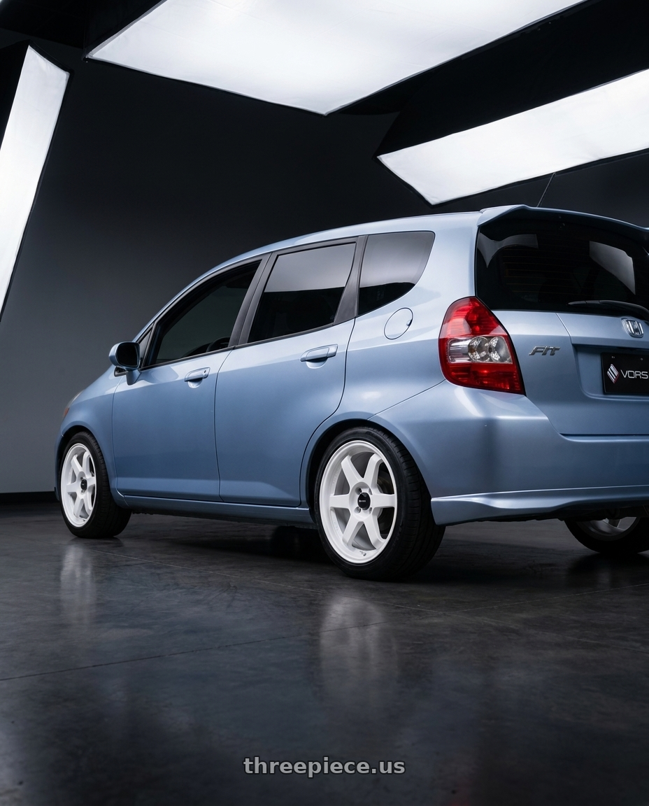 2008 Honda fit with Vors LT37 4x100 15x7  +40 White wheels rear three quarter view square tires