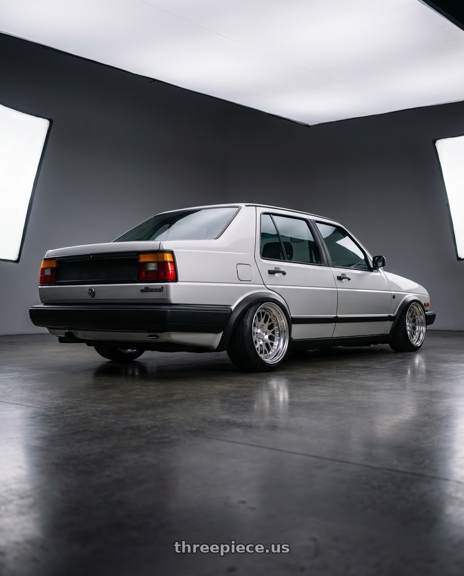 1985 VW Jetta Diesel with CCW CZ05 4x100 16x7.5 +0 Polished wheels rear three quarter view extreme stretch tires