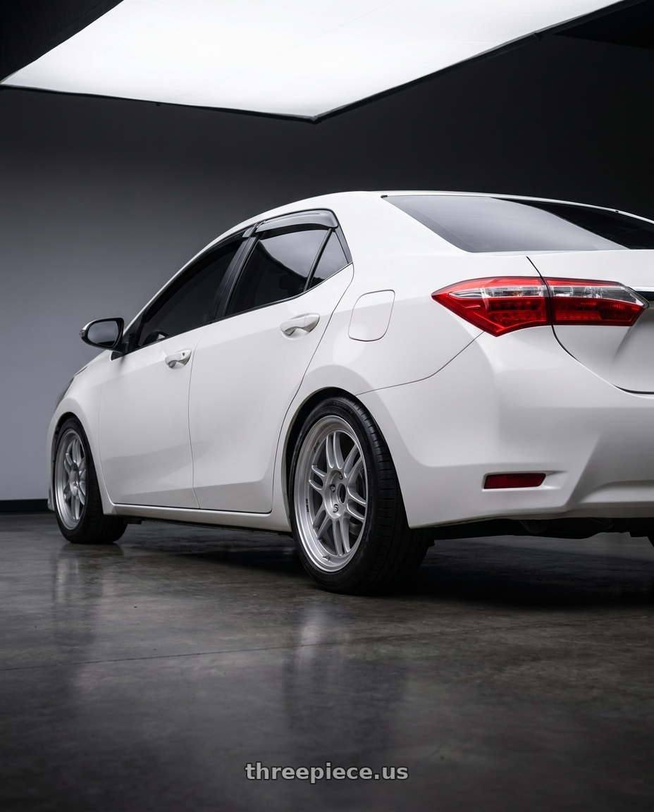 2014 Toyota Corolla with Enkei RPF1 5x100 17x7.5+48 Silver wheels rear three quarter view square tires