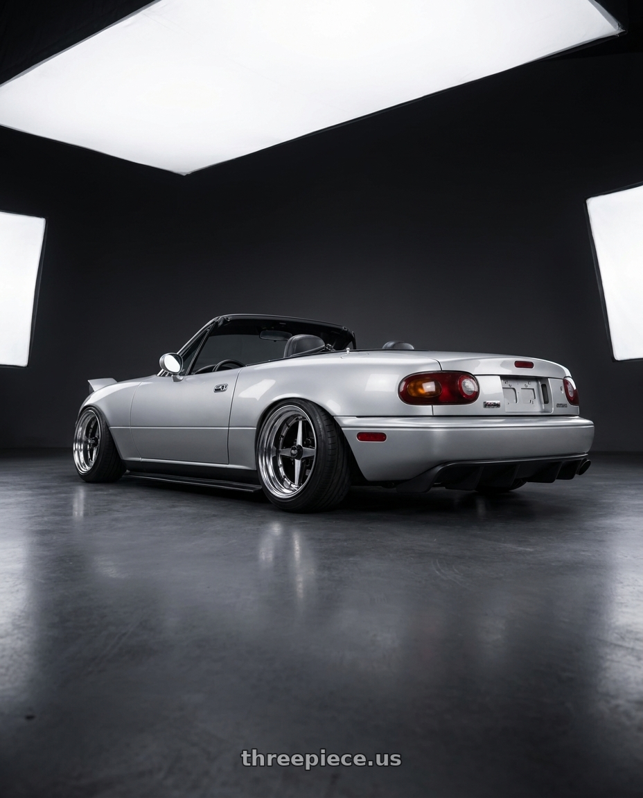 1993 Mazda Miata with Equip 01 Black Polish 4x100 15x13 -6 wheels rear three quarter view extreme stretch tires