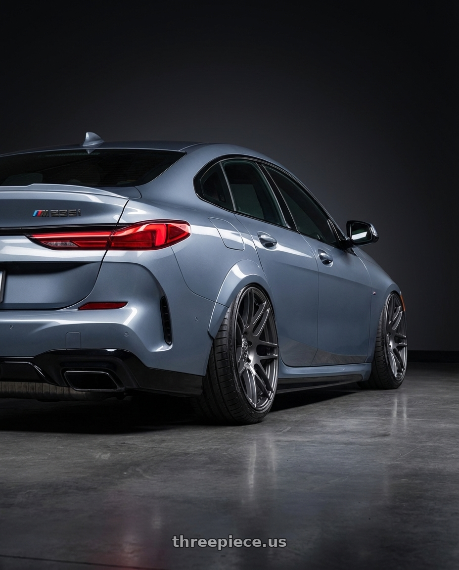 2021 BMW M235i xDrive, Storm Bay Metallic with Forgestar F14 5x120 20x10.5 +40 Gloss Anthracite wheels rear three quarter view extreme stretch tires