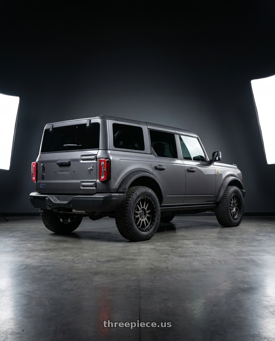 2023 Ford Bronco Badlands with Black Rhino TANAY 6X139.7 17X9 +12 MATTE BLACK W/ MACHINED FACE & DARK MATTE TINT wheels rear three quarter view square tires