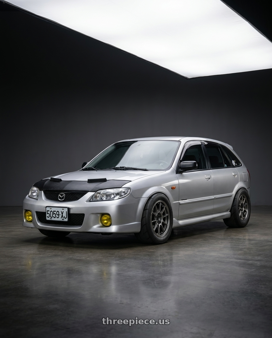Mazda 323 2000 with WedsSport TC105X 4x100 15x8.0+35 EJ Titan wheels