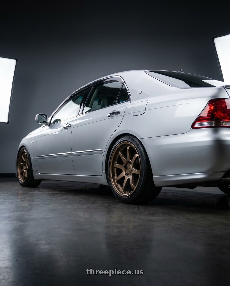 2005 Toyota Crown with Enkei Commander 5x127 18x8.5+20 Bronze wheels rear three quarter view square tires