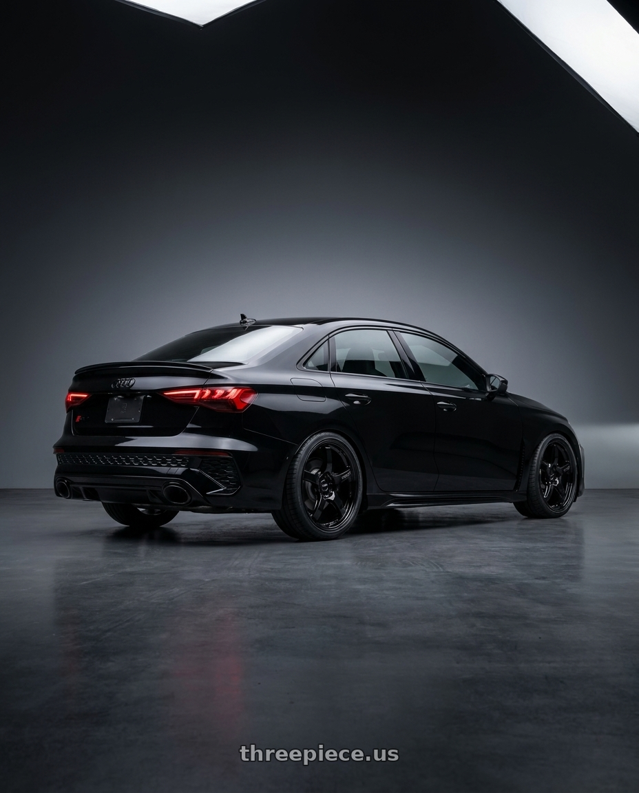 2022 Audi RS3 8Y with Gram Lights 57CR 5x112 19x9.5+25 Glossy Black wheels rear three quarter view square tires