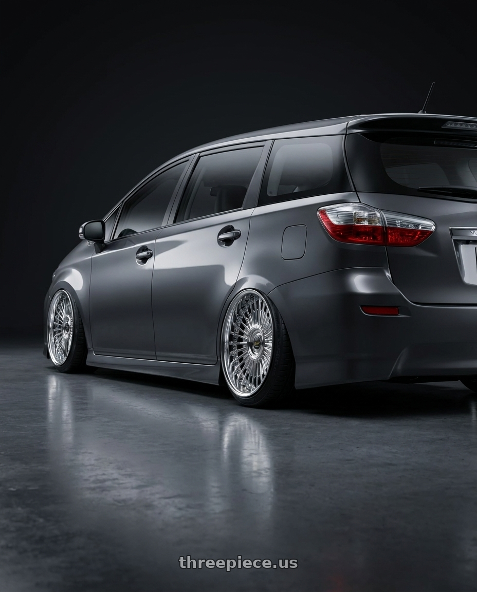2009 toyota wish with Work Emitz wheels rear three quarter view extreme stretch tires