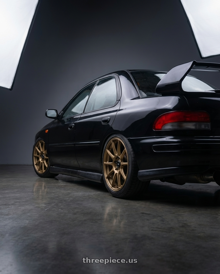 1998 Subaru Impreza GC8 with Konig Heliogram 5X100 17x8.5+38 Matte Bronze Knurled Bead Flow Formed wheels rear three quarter view square tires