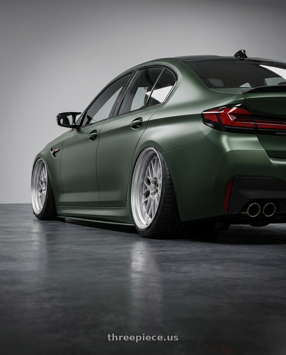 2022 BMW M5 CS with BBS LM 5x114.3 17x7.5+38 Diamond Silver wheels rear three quarter view extreme stretch tires