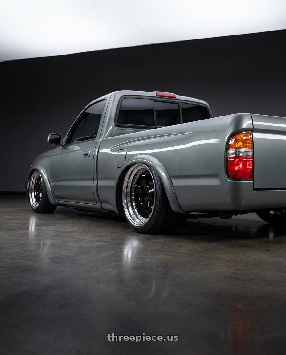 2001 Toyota Tacoma with Work Meister S1 3P 5x114.3 18x9.5+23 L Disk Black wheels rear three quarter view slight stretch tires