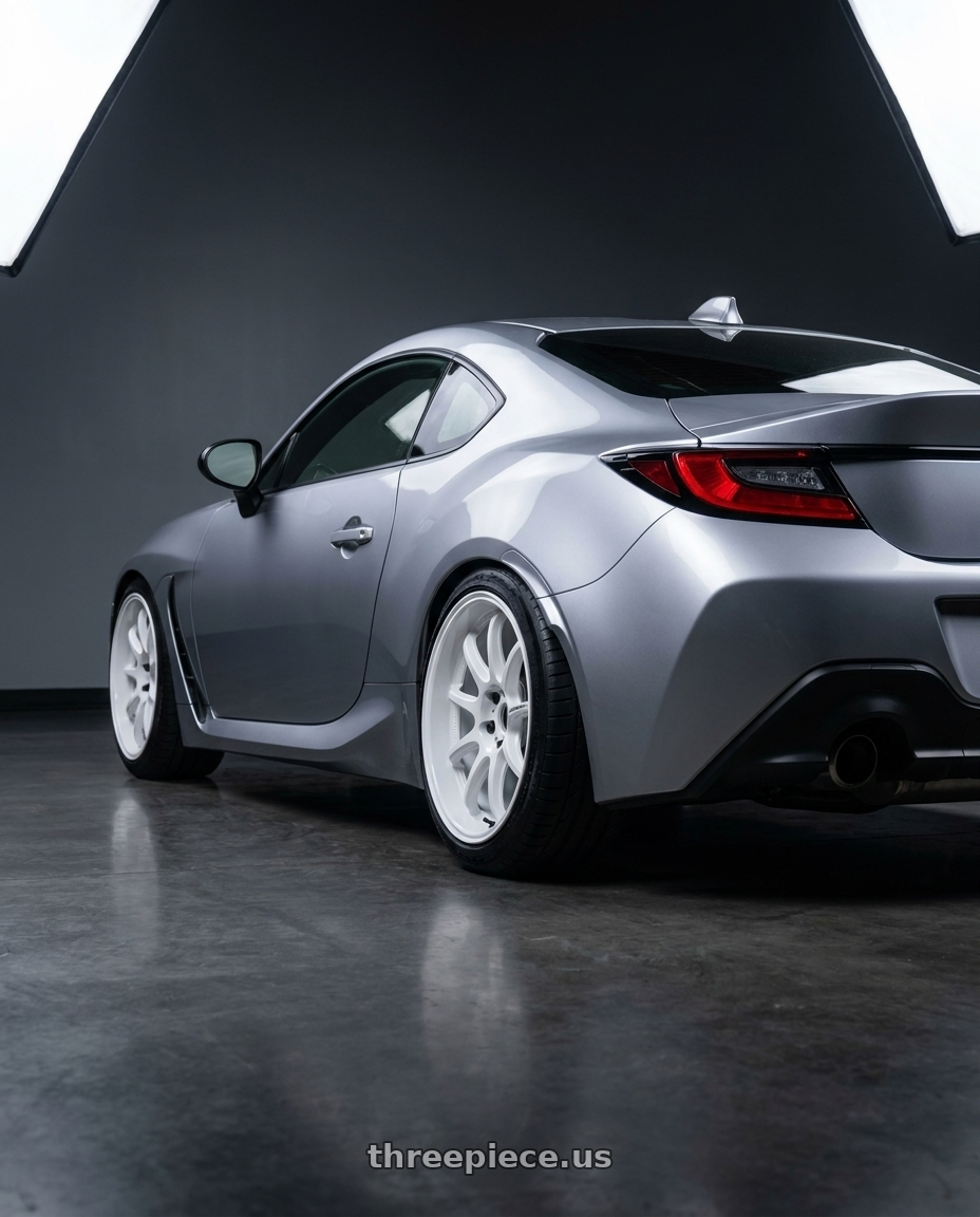 2025 toyota gr86 with Work Emotion D9r 5x100 18x9.5 +38 White wheels rear three quarter view slight stretch tires
