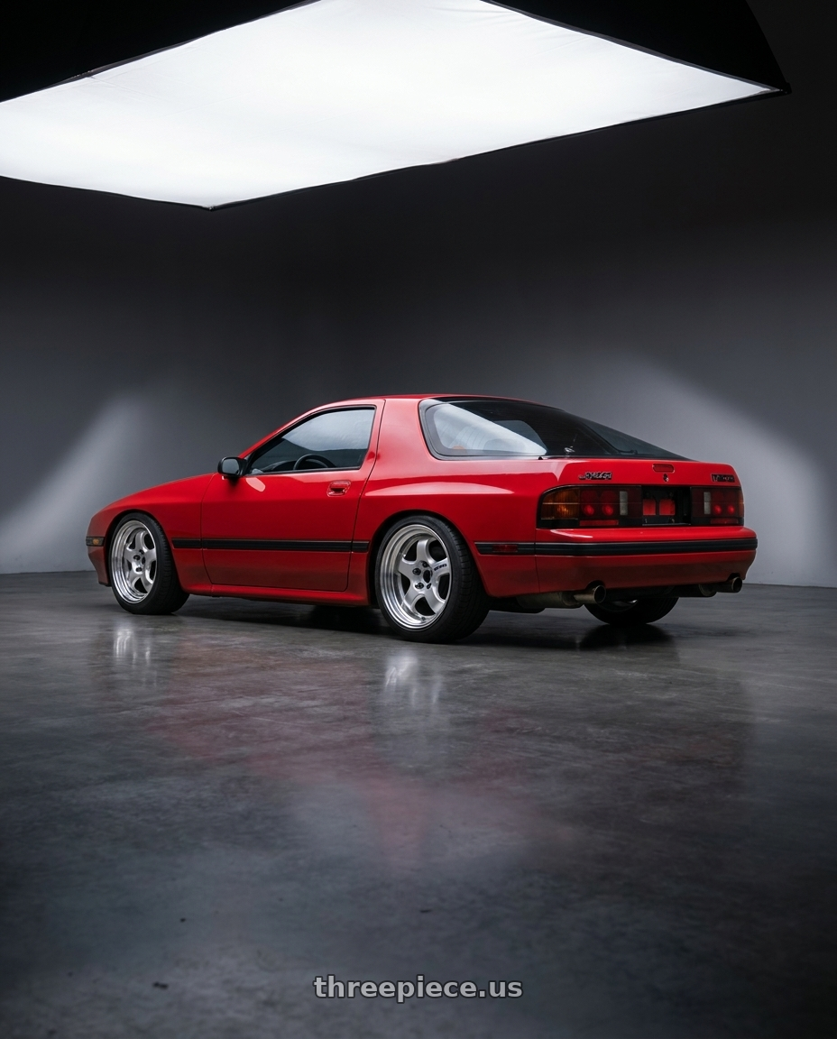 1987 Mazda Rx7 Base Red with Work Meister S1 2P 4x114.3 15x7+38 R Disk Silver wheels rear three quarter view square tires