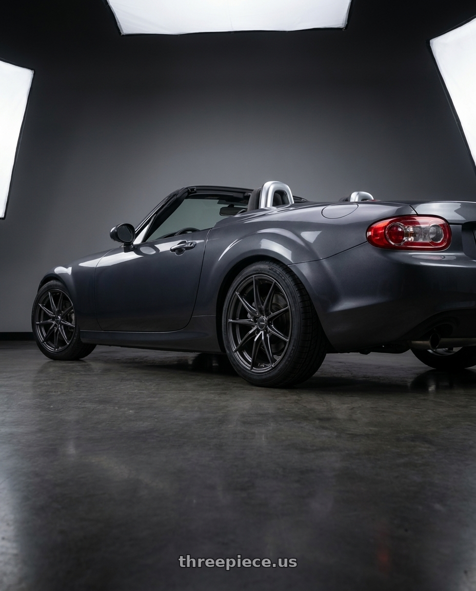 2014 Mazda Miata with Enkei DRACO 5x114.3 17x7.5+38 Anthracite wheels rear three quarter view square tires