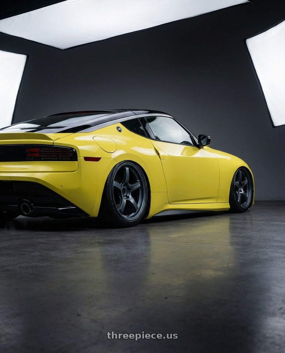 2024 Nissan Z with Gram Lights 57CR 5x114.3 19x9.5+35 Gunblue II wheels rear three quarter view slight stretch tires