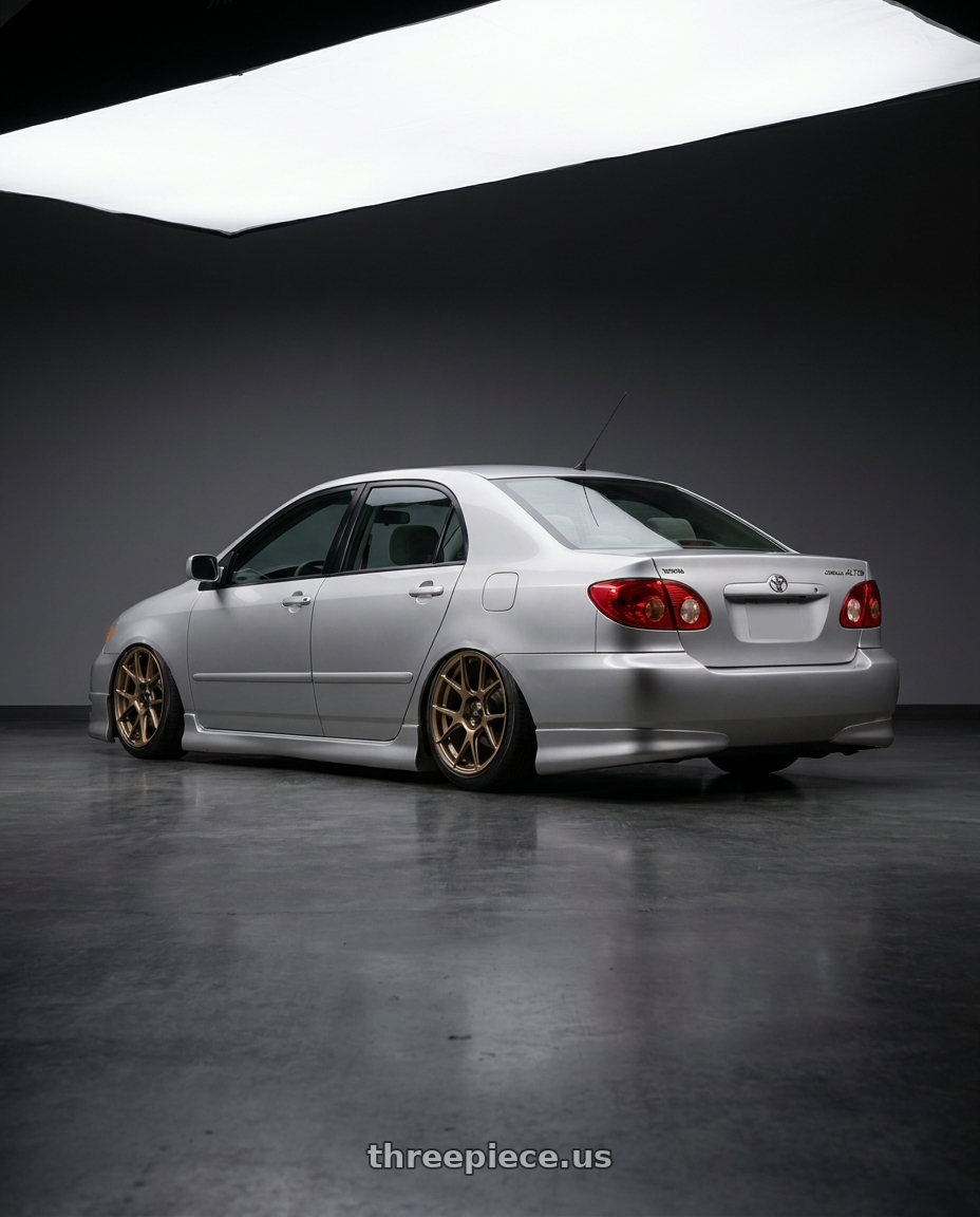 2006 Toyota corolla altis with Konig Ampliform 4x100 17x8+45 Gloss Bronze wheels rear three quarter view slight stretch tires