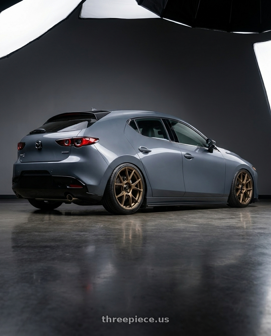 2023 Mazda Mazda3 Turbo with Konig Ampliform 5x114.3 18x9.5+35 Gloss Bronze wheels rear three quarter view slight stretch tires