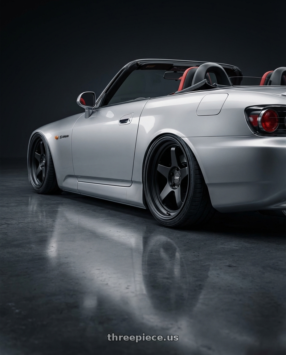2009 Honda S2000 with ESR Wheels APEX SERIES AP5 5x114.3 18x9.5 +22 Matte Black wheels rear three quarter view slight stretch tires