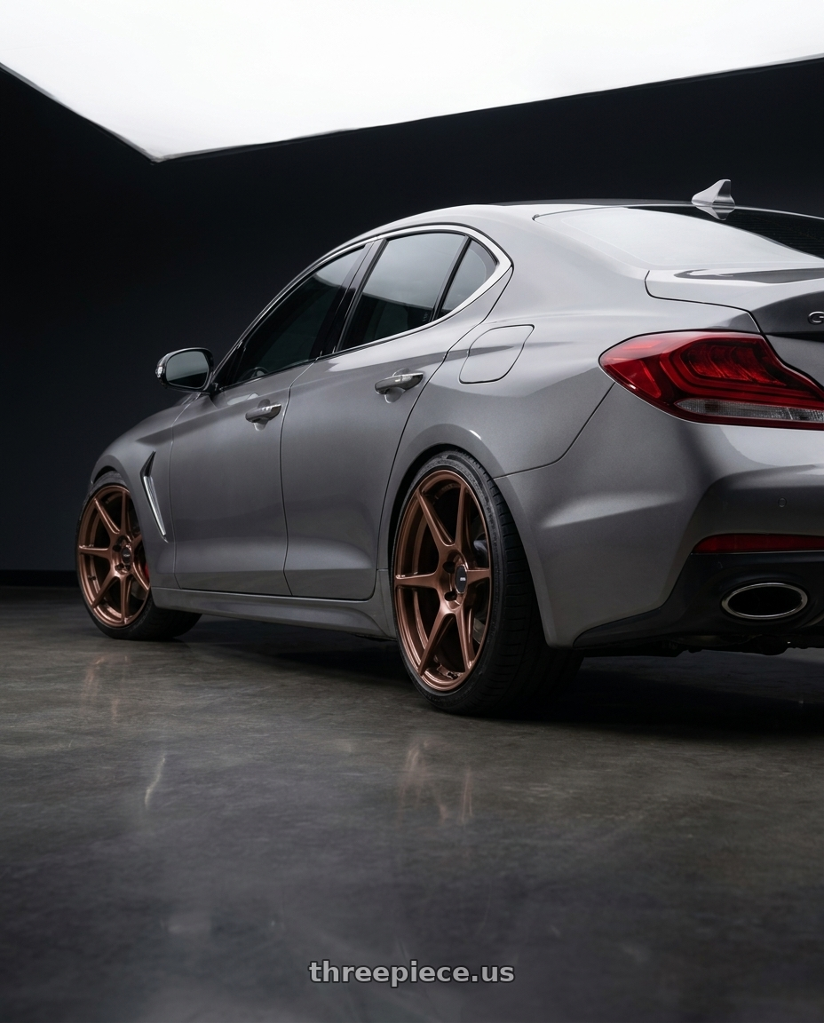 2019 Genesis G70 with Enkei TFR 5x112 19x8.5+35 Copper wheels rear three quarter view slight stretch tires