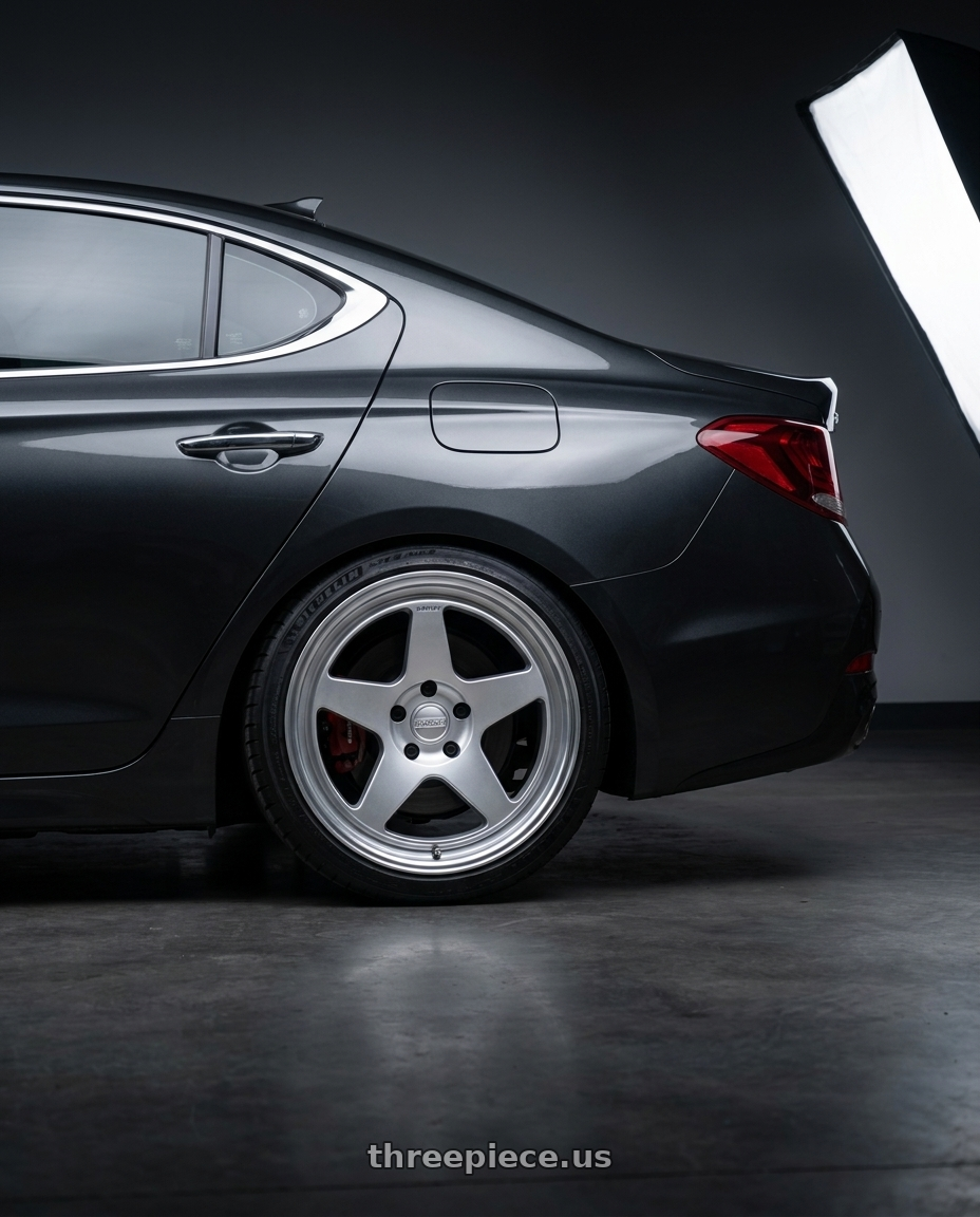 2019 Genesis G70 with Kansei K12H KNP 5X100 17x9 35 Hyper Silver wheels rear three quarter view slight stretch tires